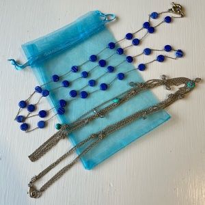 Two long blue and mixed metal necklaces
